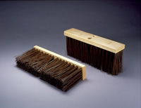 Two outdoor push brooms